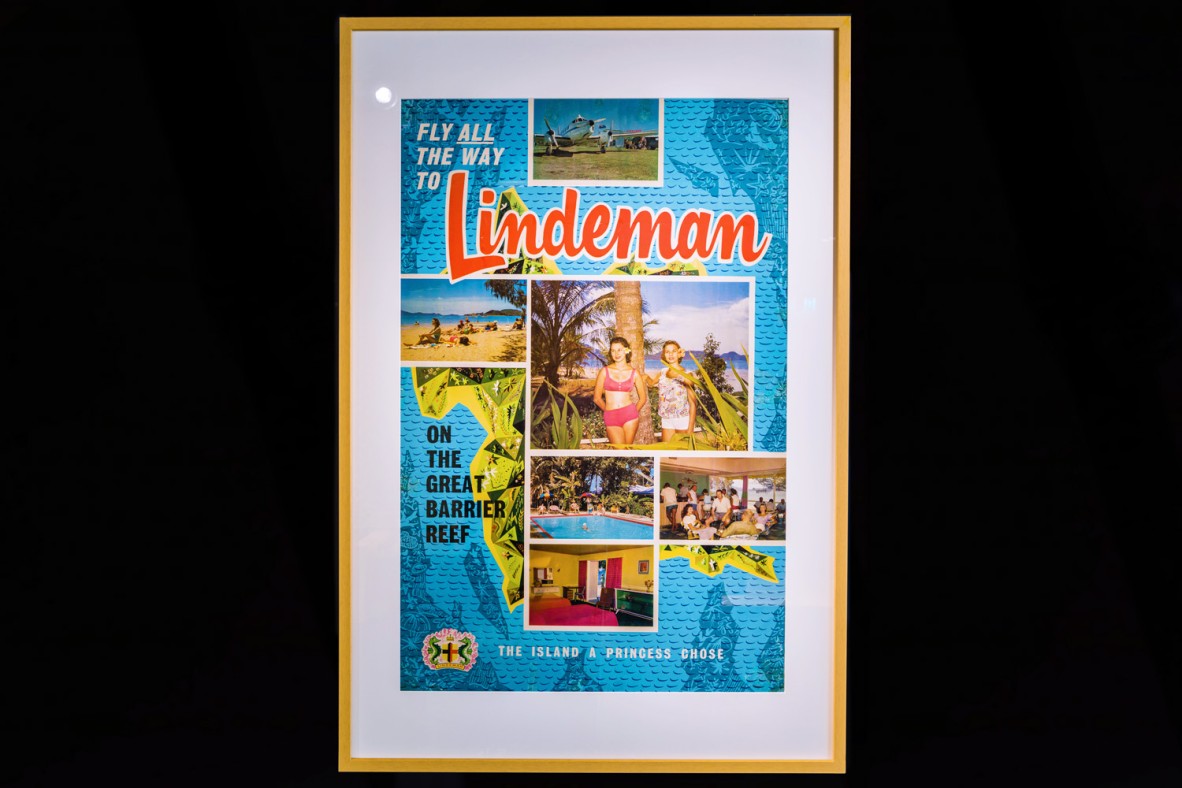 Framed poster advertising tourism to Lindeman Island.