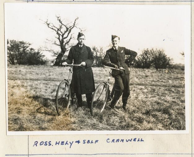 Charles Williams and Ross Hely posing with bicycles while station in 1942 at Cranwell.