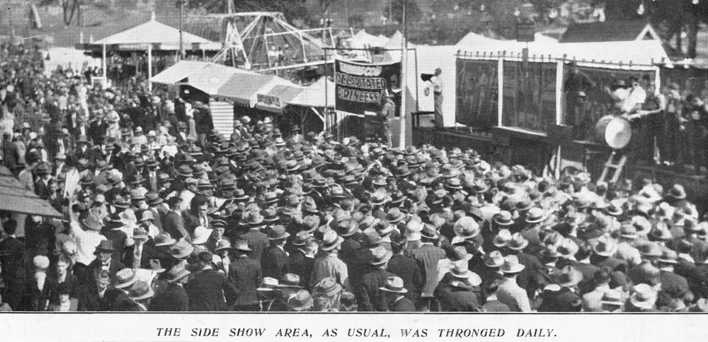 Crowd gathers in sideshow alley, Brisbane Exhibition Grounds, 1933