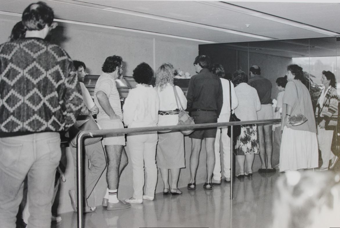 people line up at a cafe in 1988