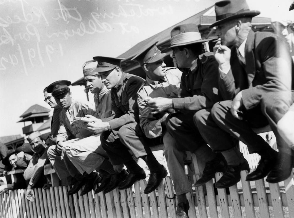 Soldiers sitting on the fence watching the races at Albion Park, Brisbane