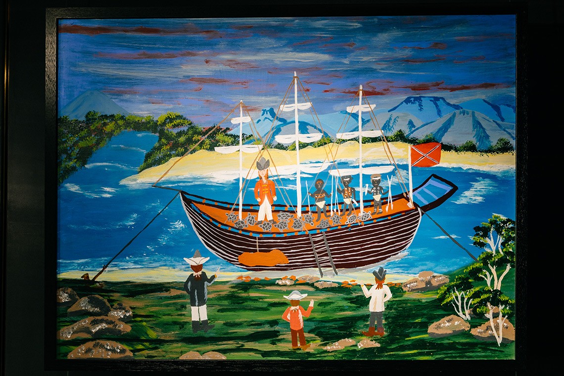 The painting entitled ""Twelve Turtles"" depicts the First Nations’ oral history of Captain Cook’s landing at Endeavour River. The painting is acrylic on plywood and depicts Cook's ship in the Endeavour River with the twelve turtles, Captain Cook, and three Bama people onboard carrying spears. Some of Cook's men are watching from the shore.
