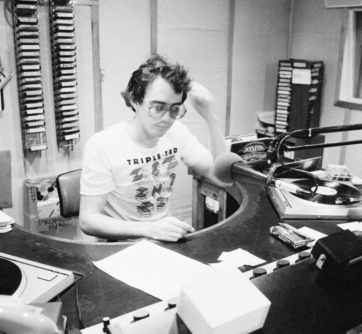 A photo of a 4ZZZ radio announcer (Phil Cullen) in the studio