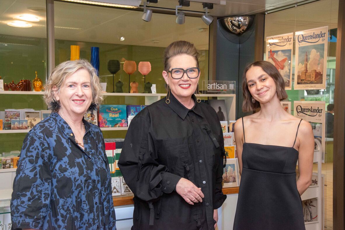 Three women in shop setting