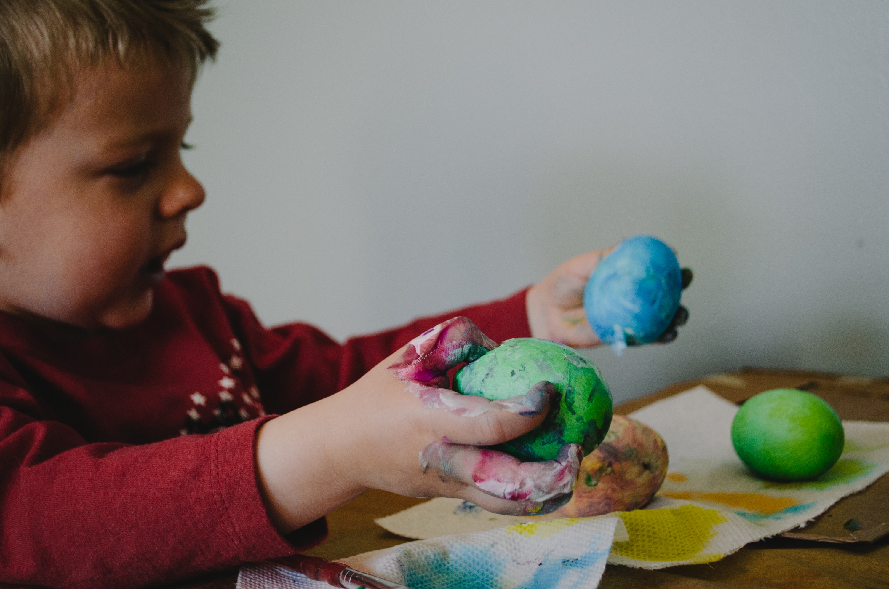 Child playing with play-dough inside