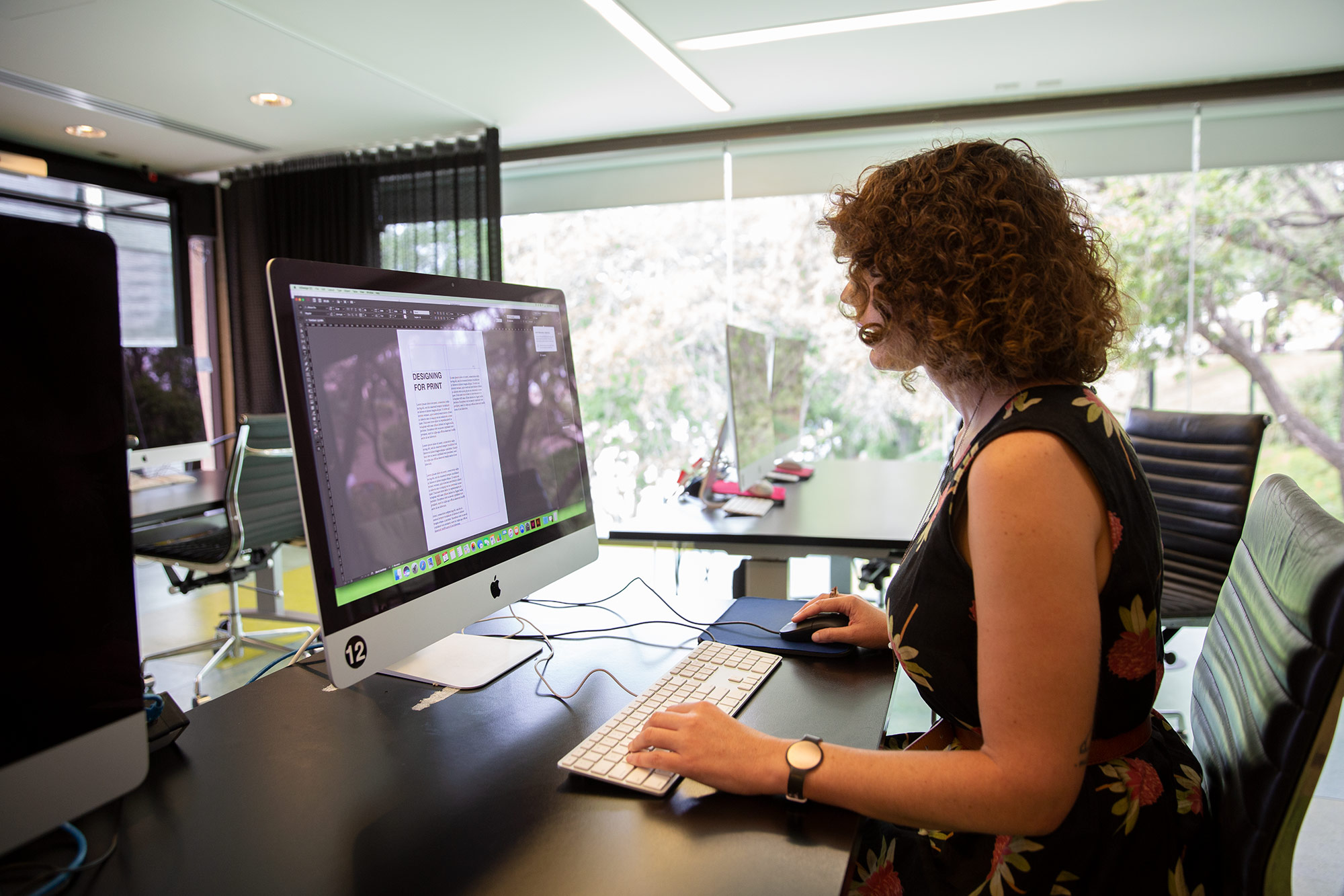 Woman using a mac computer