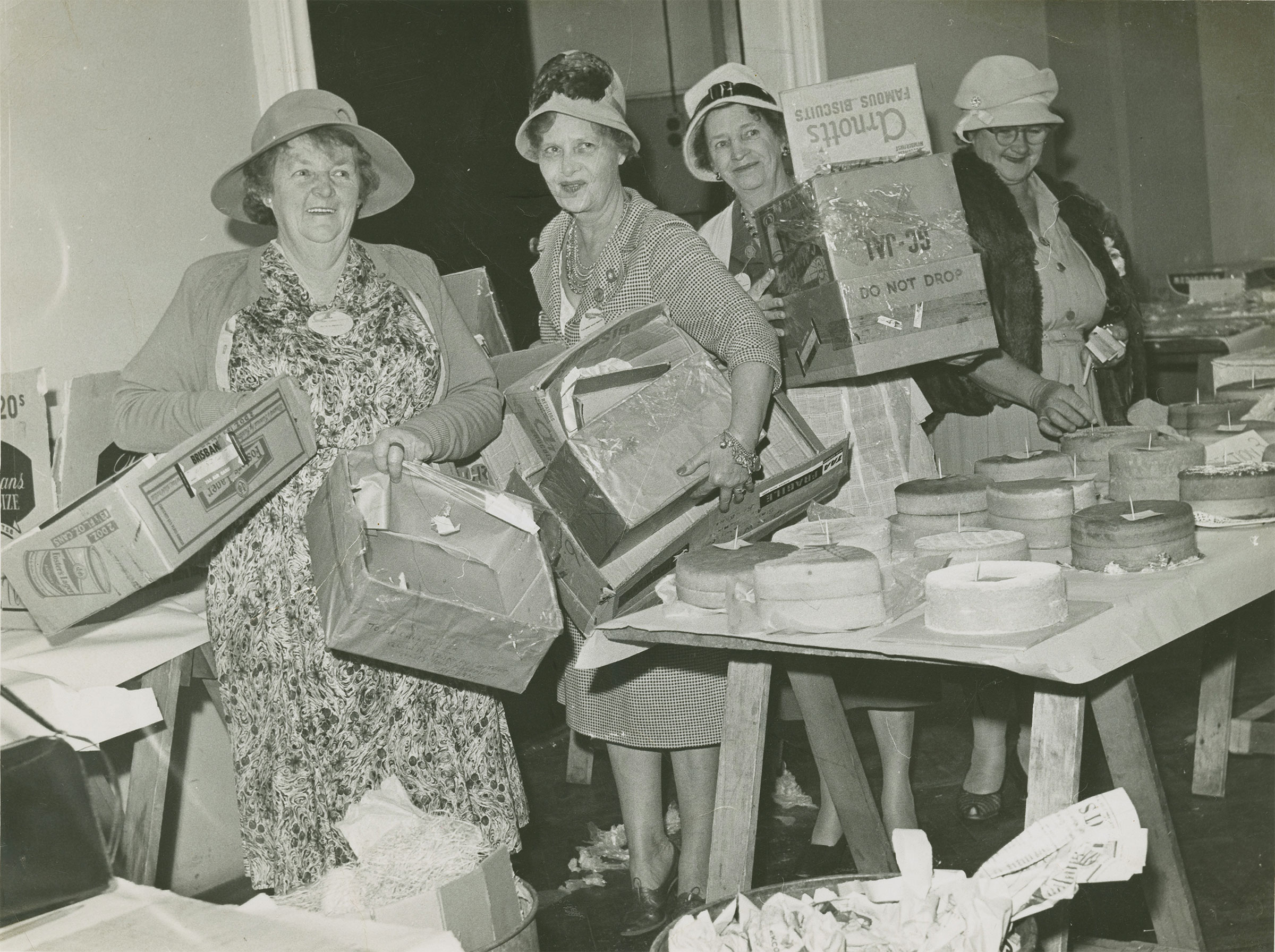 Women from the Queensland Country Women s Association unpacking cakes